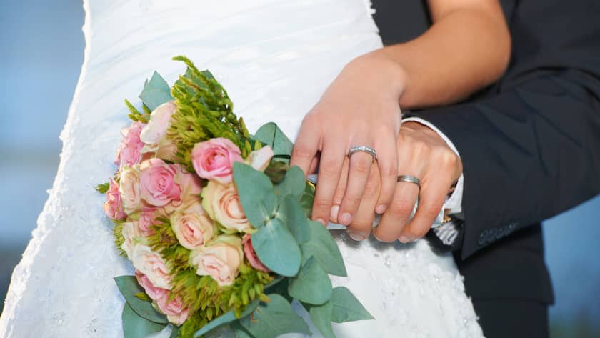 A wedding scene with a focus on the couple's financial considerations and potential tax implications.