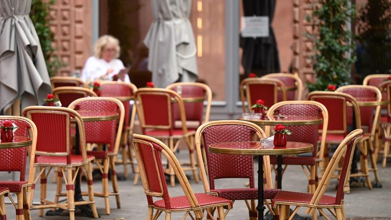Empty cafe tables in Frankfurt's old town