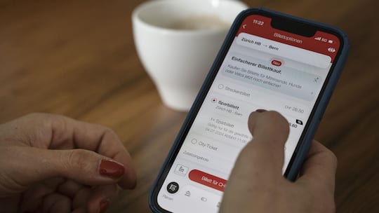 A woman selecting saver tickets on her smartphone