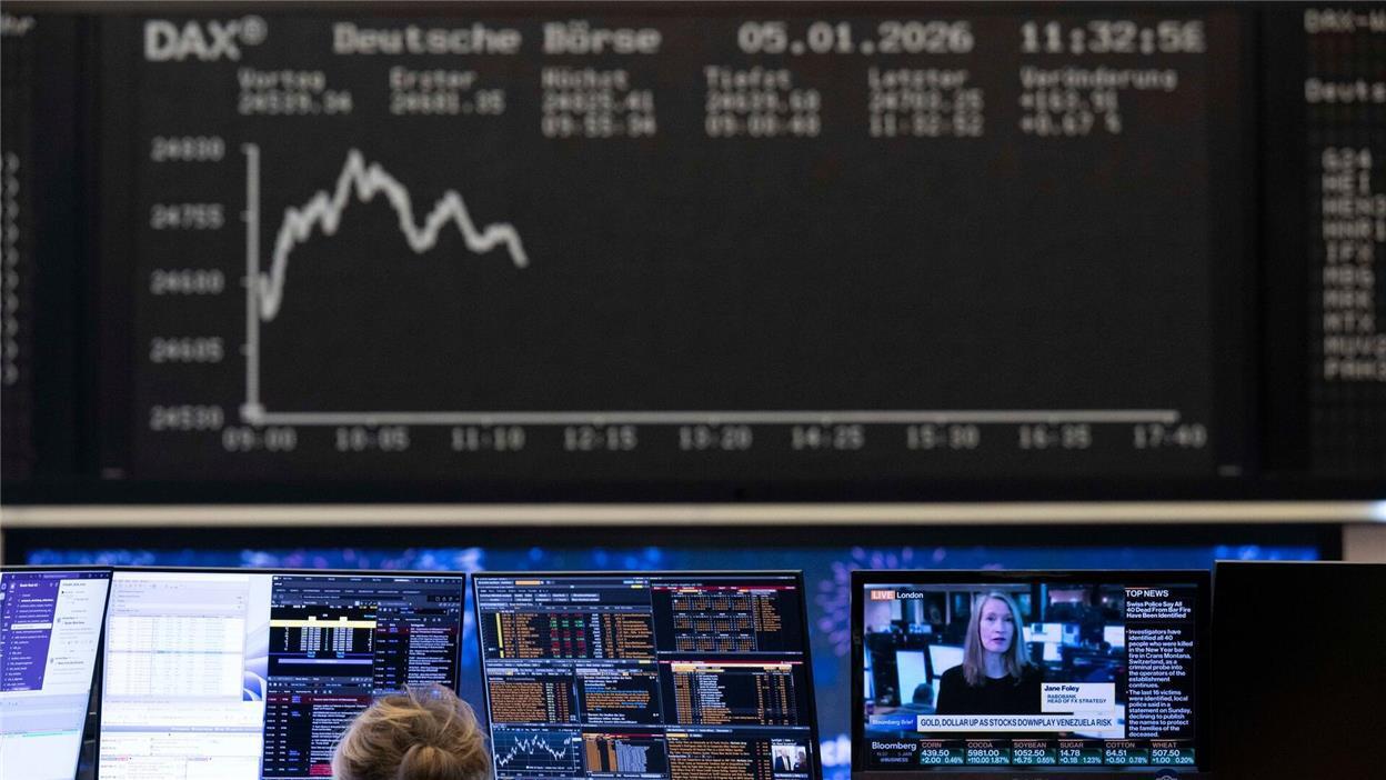 Stock traders monitor price developments on their screens at the Frankfurt Stock Exchange