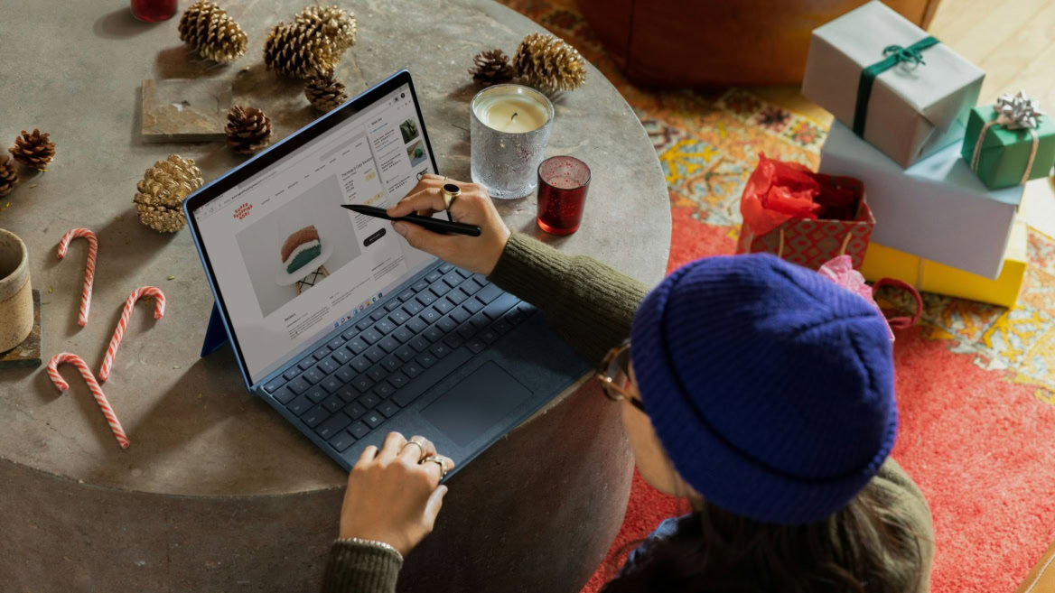 French micro-entrepreneur working on computer reviewing financial documents