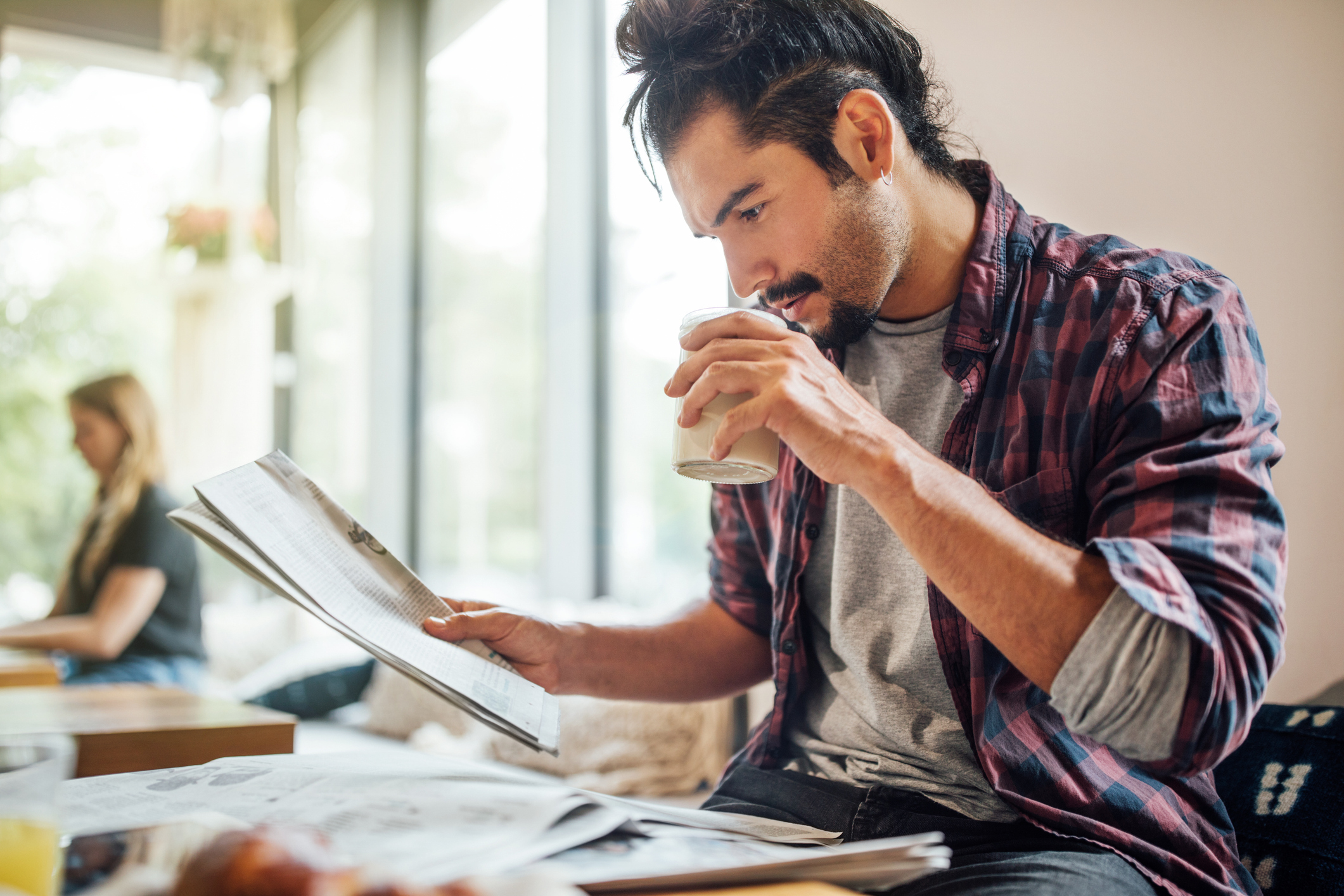 An Austrian worker reviewing salary statements and calculating net pay