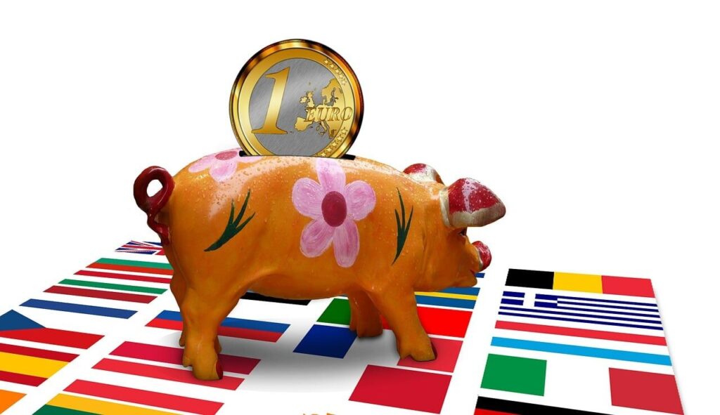 Piggy bank with coins representing student debt savings strategy
